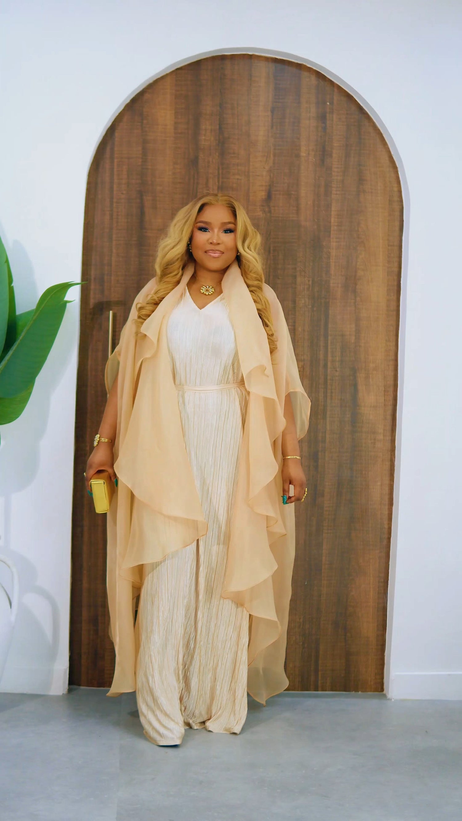 Nude Saeeda Dress Set from Nahota Kanma, featuring a pleated inner maxi dress and a ruffled organza overlay.