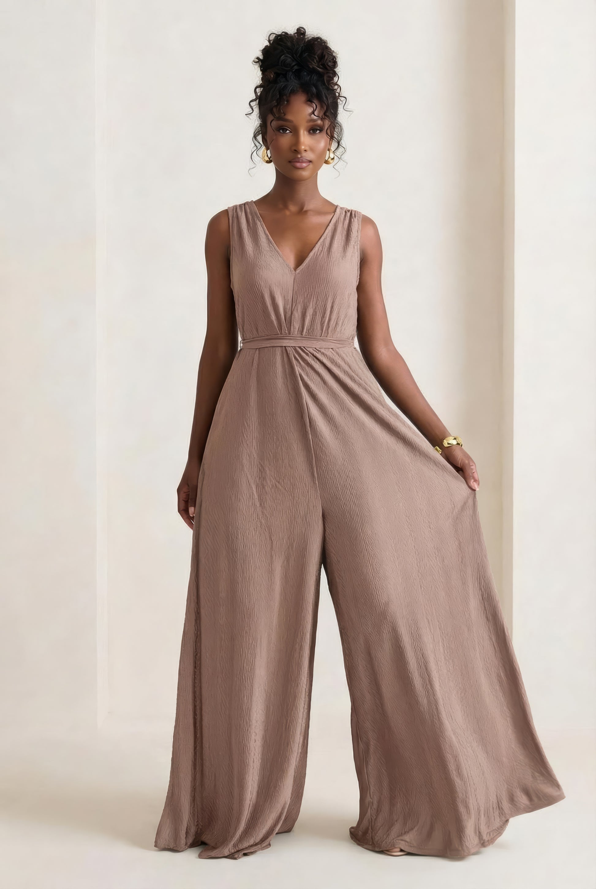 Saeeda Jumpsuit in timeless taupe worn by a model.