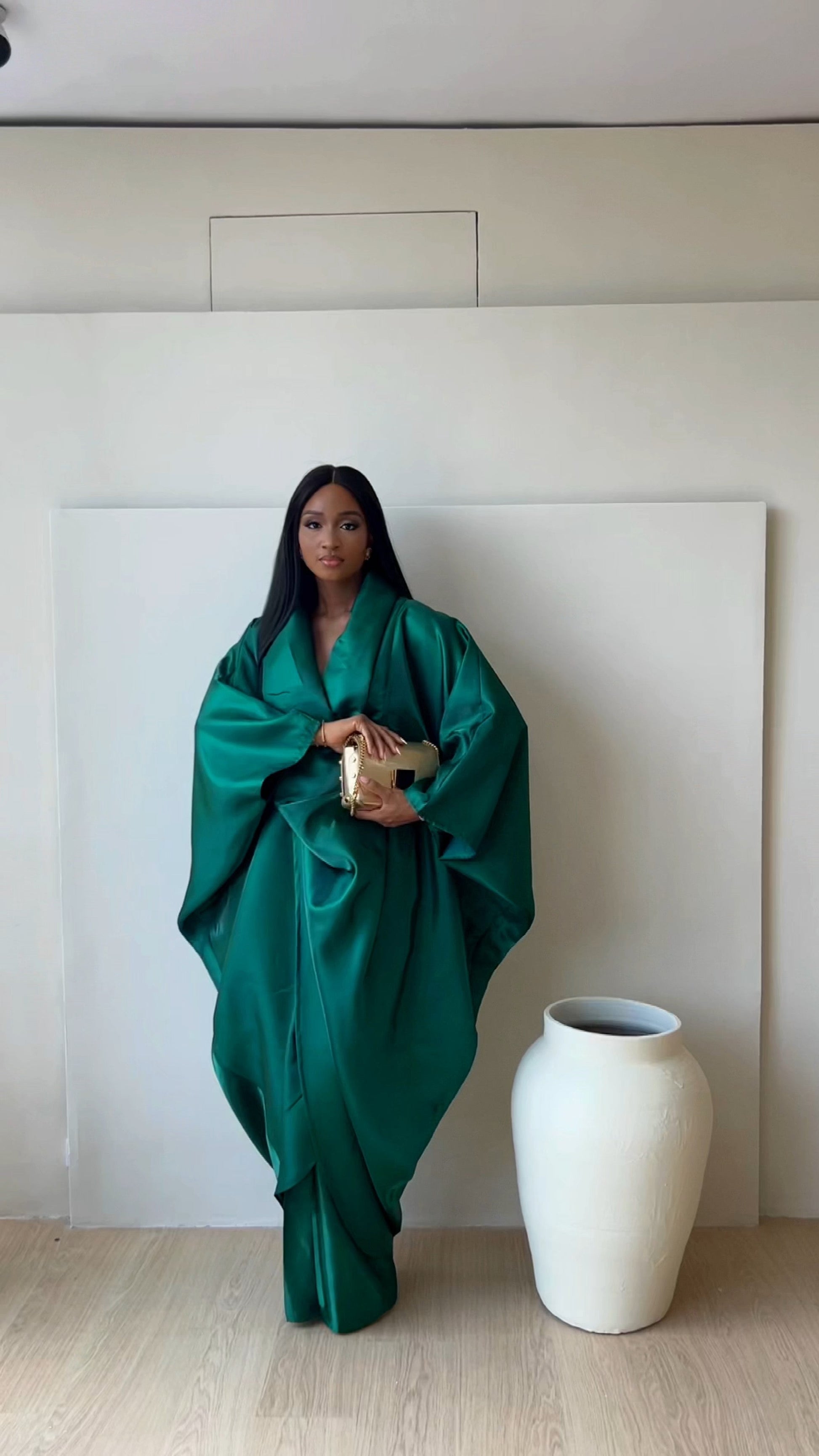 Emerald green Farida Set (silk satin blouse and top/kimono) from Nahota Kanma, featuring oversized batwing sleeves and draped silhouette.