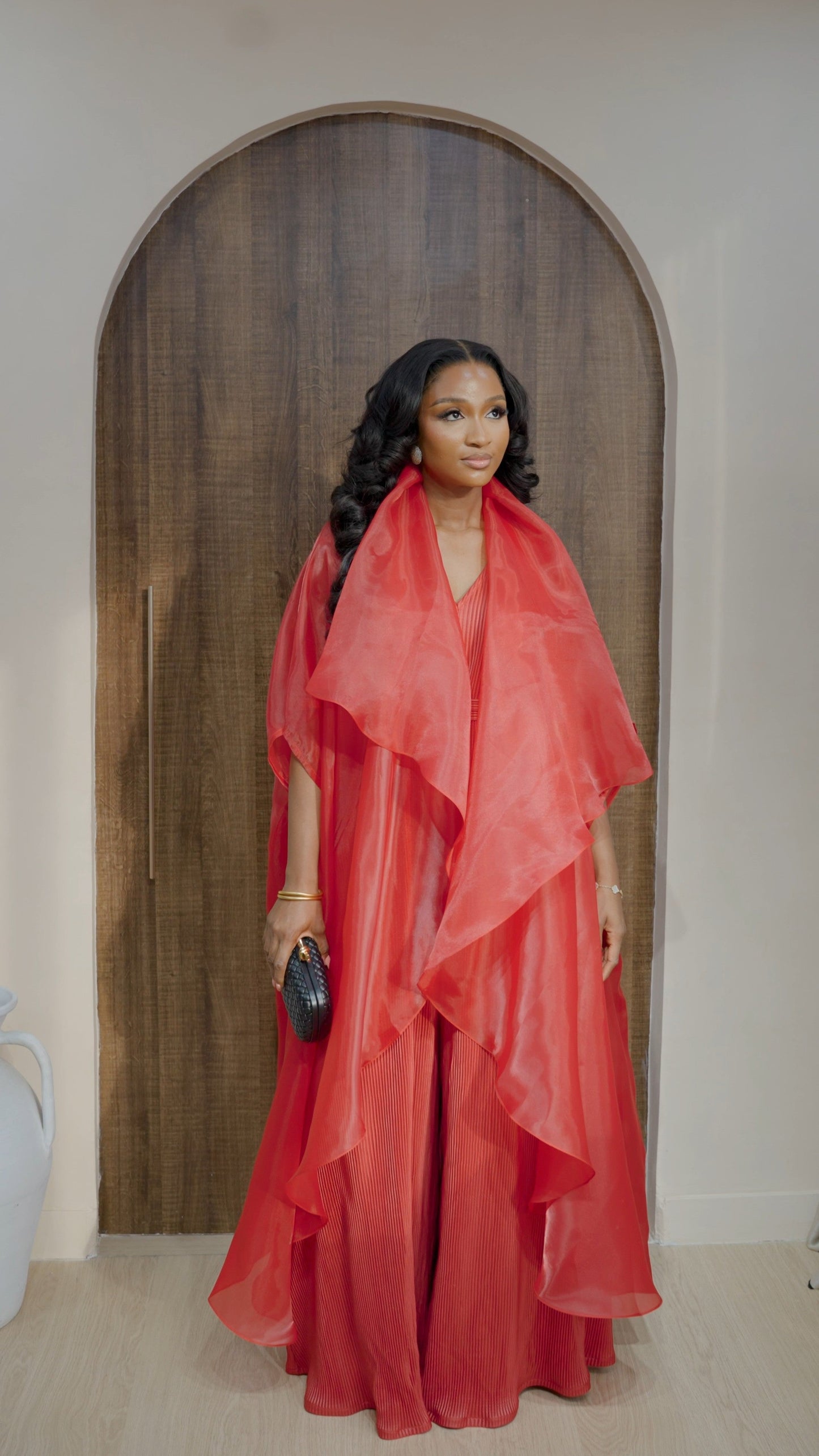 Saeeda Set in bold red worn by a model.