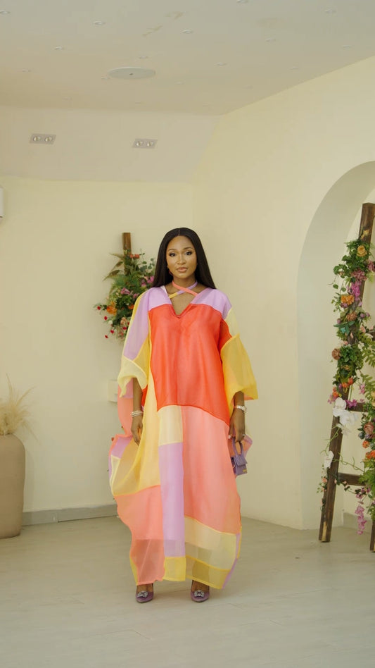 Multi-colored pastel patchwork Leora Kaftan from Nahota Kanma, made from sheer seersucker fabric.